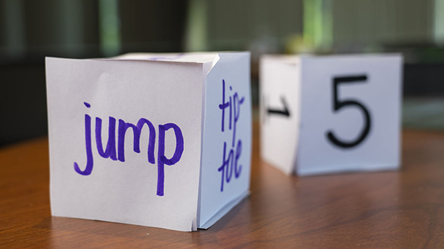 Two dice with one reading 5 and the other jump