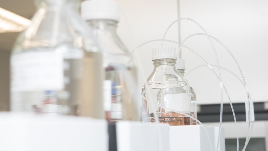 Clear glass beakers with plastic tubing coming out