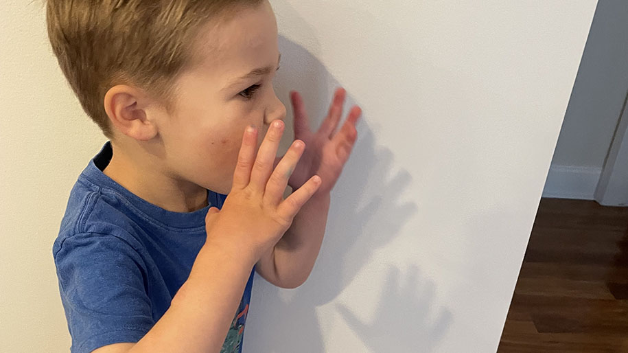 Child shouting ou answer to the charades game