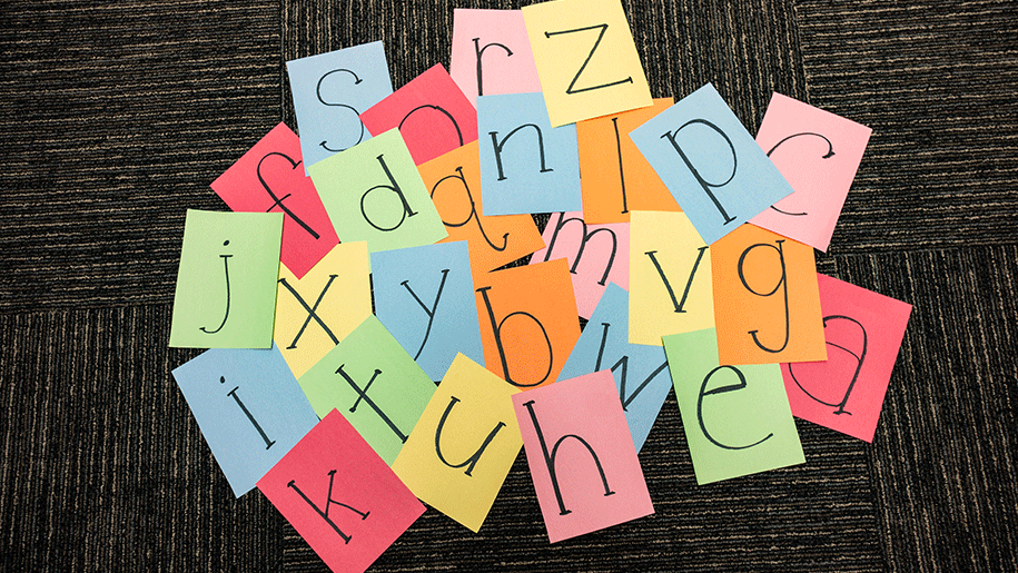 Paper squares with black letters 