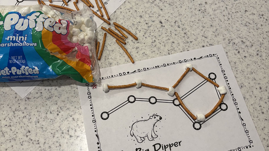 Outline constellation on paper with pretzels and alternating mini marshmellows.