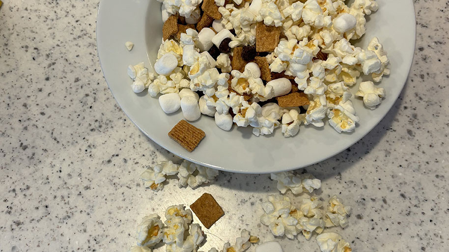 Dish with popcorn and golden grahams