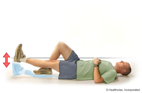 A man doing straight-leg raises to the front A man doing straight-leg raises to the front