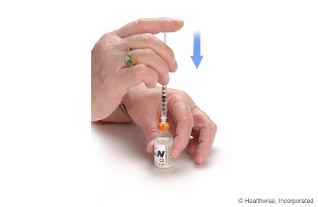 Forcing air into the cloudy insulin bottle Forcing air into the cloudy insulin bottle
