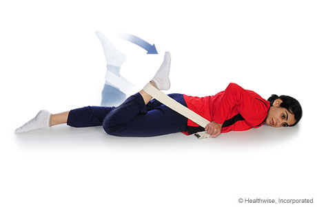 A woman doing a quadricep stretch (facedown)