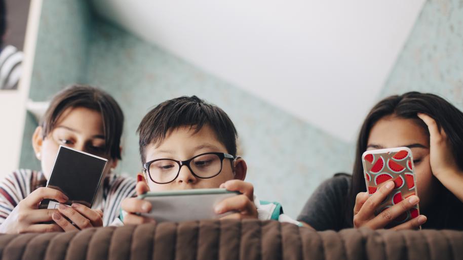 Children looking at cellphones
