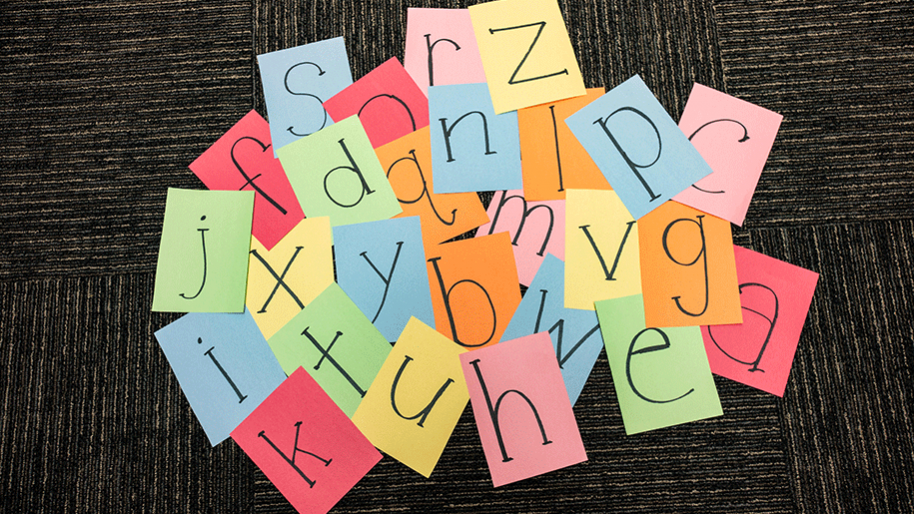 Paper squares with black letters 