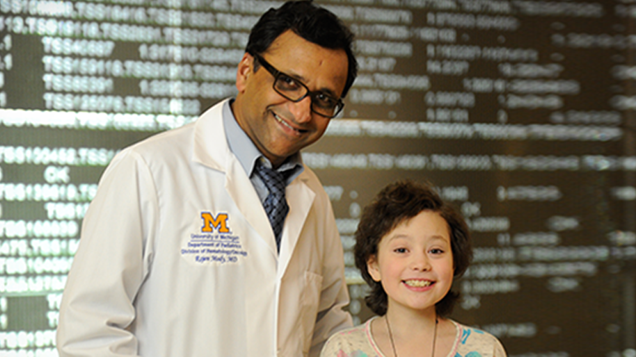 Dr. Rajen Mody with a young female patient