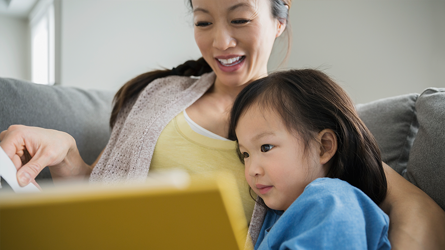 Mother reading to her daughter