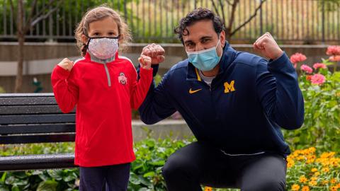 Chloe in OS and Dad in Michigan outfit.