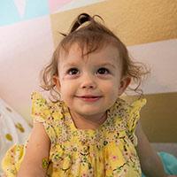 Little Girl on Bed Smiling